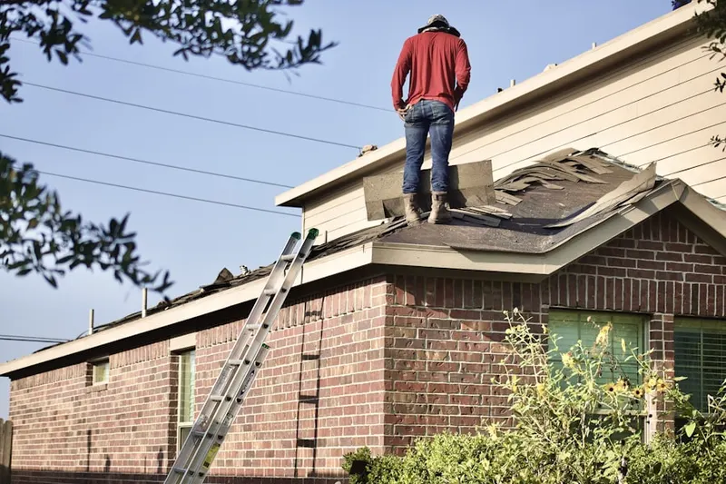 Professional roofer working on a residential roof in Sierra Madre
